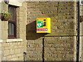 SD9605 : Defibrillator on the Three Crowns public house, Scouthead by JThomas