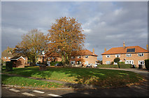 TG2429 : Houses on Highfields, Felmingham by Ian S