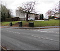 Three dark green telecoms cabinets on a north Brecon corner