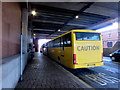 Yellow Manchester coach at bus stop Q2, Queensway, Newport