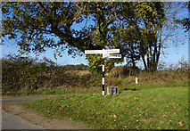 TG2037 : Road junction on Cromer Road by Ian S
