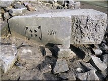 SK1888 : Date stone in the remains of the demolished church of St. John and James, the lost village of Derwent by Benjamin Shaw