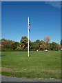 TM2564 : Flagpole on Saxtead Green by Geographer