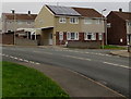 Rooftop solar panels on a suburban corner, Bridgend