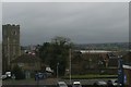 Strood church from the train, on a dark November day