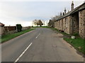 NT9529 : The junction of the B6351 with the A697 at Akeld by Peter Wood