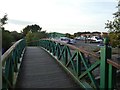 SK9373 : Footbridge between Burton Waters marina and Fossdyke Navigation by David Smith