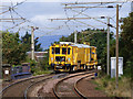 A yellow machine passing through Troon