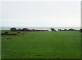 Hay field between the A2 and the cliff coast south of the incised estuary of  Phellim