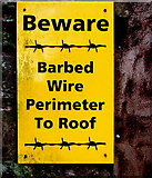 ST1195 : Beware - Barbed Wire Perimeter To Roof, St John the Baptist church, Nelson by Jaggery