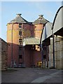 SO9941 : Brick silos, Chapel Farm by Philip Halling