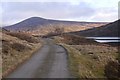 NN6371 : Road beside Loch Garry by Richard Webb