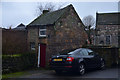 SK2853 : Small House and Car in Wirksworth, Great Britain by Andrew Tryon