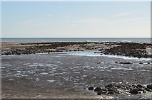 TQ8913 : Rocks at low tide by N Chadwick