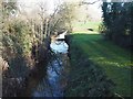 Looking along stream alongside golf course