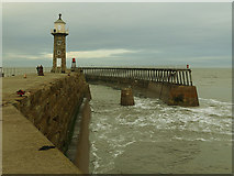 NZ9011 : Whitby East Pier with lighthouse and breakwater by Stephen Craven