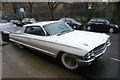 View of a Cadillac parked outside the shops on Snowsfields