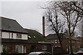 View of a factory chimney on Webster Road from St. James