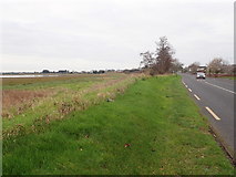 J0602 : The R172 (Coast Road) running West parallel with the Fane Estuary by Eric Jones
