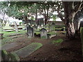 Old gravestones at the Parish Church of Saint Deiniol and Saint Marcella, Marchwiel