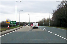 TM1322 : B1033 Colchester Road meets the A133 at a roundabout by Robin Webster