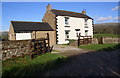 NY6823 : House beside Frith Lane at Esplandhill by Roger Templeman