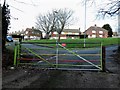 Coloured gate across Broomgrove Road