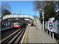 Train and Footbridge at West Finchley