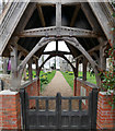 Looking through gate to Ashill Church