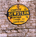 SK8821 : Old circular AA Sign on Main Street, Sewstern by Milestone Society