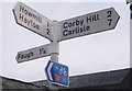 NY5056 : Direction Sign - Signpost in Fenton village by I Davison