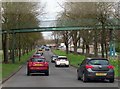 SP3477 : London Road runs under a footbridge by Steve Daniels