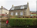 Letterbox and house on Woodriffe Road, Newburgh