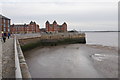 Sea wall and flats by Coburg Wharf