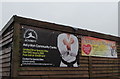 Valley Taekwondo Academy banner and Slimming World banner on an Ael-y-bryn shed