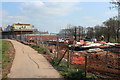 Houses under construction next to canal