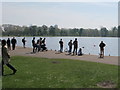TQ2680 : Visitors by Kensington Gardens Round Pond by David Hawgood