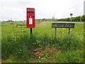 Elizabeth II post box and minor road sign