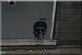 View of skull street art on the front of Coleman House (behind Boots on Penge High Street)