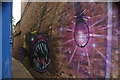 View of anglerfish street art in a narrow alley off Penge High Street #2