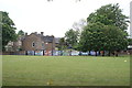 View of street art on a wall at the rear of the playing field of the Harris Primary Academy Crystal Palace