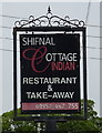 Sign for the Indian restaurant on Watling Street (A5)