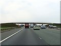 The M56 runs under a footbridge