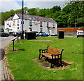 Bench and telecoms cabinets on a green, Ystradgynlais