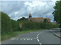 SY4597 : B3162 Salway Ash, and Holy Trinity Church by Chris Gunns