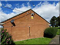 Yellow warning sign on a Malpas Road building, Newport