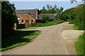 Road and farm buildings, Aston le Walls