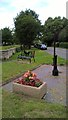 TF1505 : Parish water pump, seat and planter on High Street, Glinton by Paul Bryan