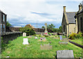 NZ2758 : Graves and war memorial, Church of St. Thomas, Eighton Banks by Trevor Littlewood