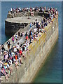 SX0351 : Spectators on the harbour wall during the raft race at Charlestown Regatta by Rod Allday